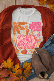 White crewneck tee with pink and orange abstract autumn graphic featuring a pumpkin.