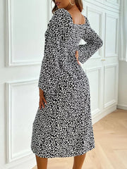 Floral print midi dress with flare sleeves and square neckline in black and white ditsy pattern.