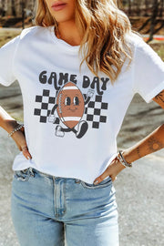 White polyester graphic tee with a cartoon football and "GAME DAY" text on a checkered background.