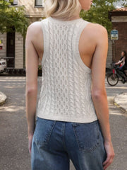 Beige cable knit tank top with racerback and textured pattern.