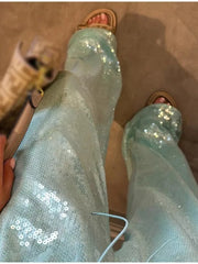 Light blue wide leg sequin pants with drawstring detail.