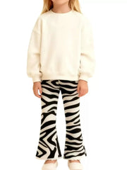Zebra print flare pants for kids, black and white animal print trousers with a flared leg.