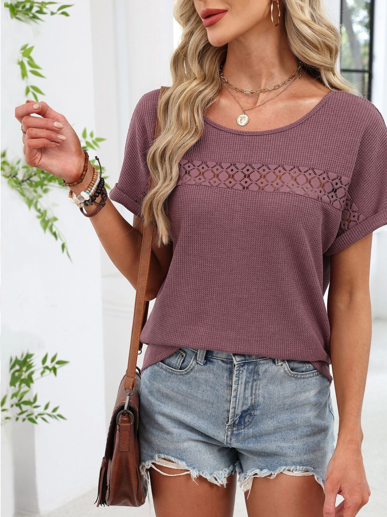Purple waffle knit tee with short sleeves and a lace inset detail across the chest.