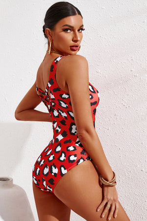 Red leopard print one-piece swimsuit with crisscross back detail