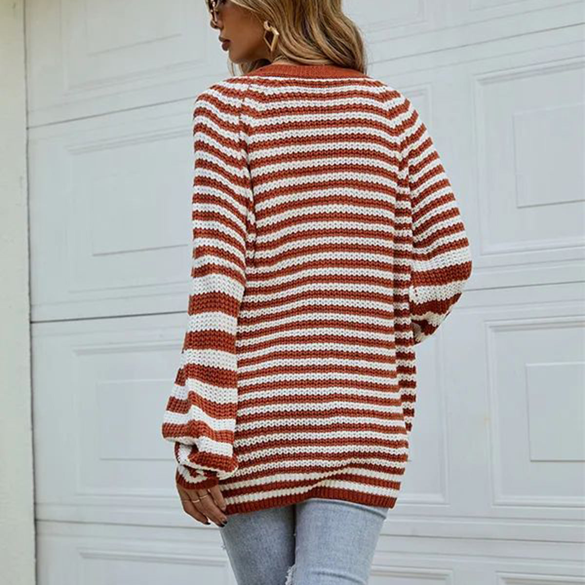Chestnut and white striped knit button-up cardigan with balloon sleeves.