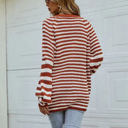 Chestnut and white striped knit button-up cardigan with balloon sleeves.