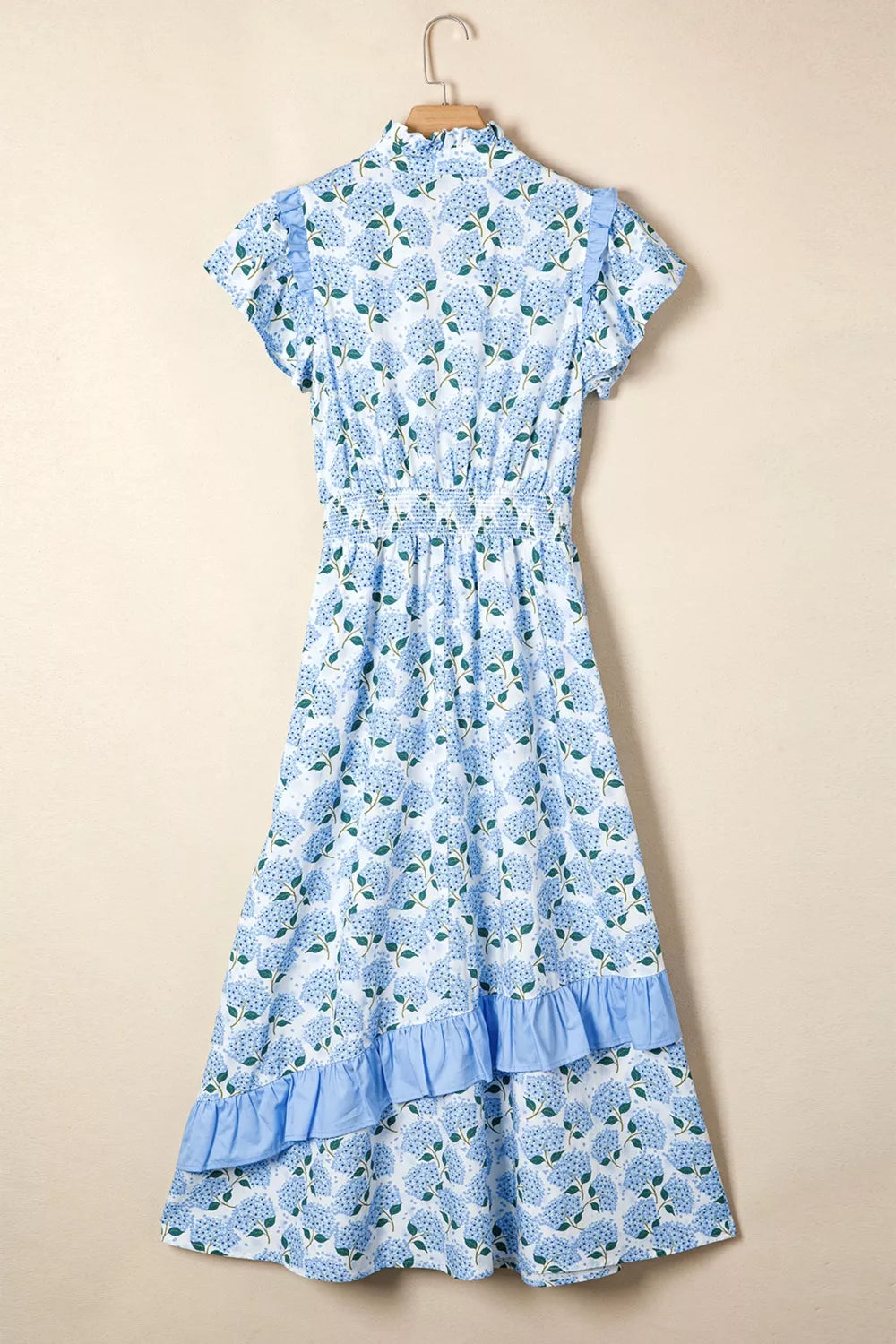 Hydrangea print midi dress with flutter sleeves, ruffled tiers, and smocked waist.