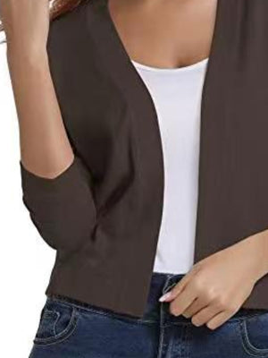 Cropped elbow-sleeve open-front knit cardigan in Chocolate, worn over a white tank top.