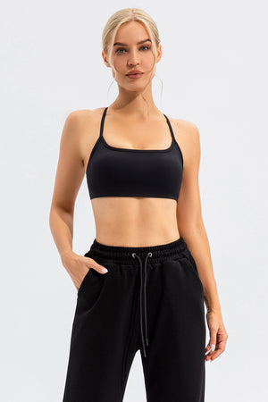 Black sports bra with thin straps and square neckline