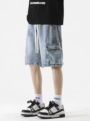 Light wash denim cargo shorts with drawstring and utility pocket.