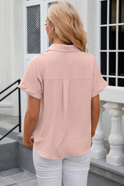 Textured short sleeve collared shirt in watermelon pink with a relaxed fit and cuffed sleeves.
