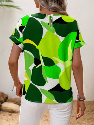 Women's abstract floral print t-shirt in green, white, yellow, and black with short sleeves and a keyhole back detail.