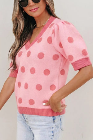 Pink polka dot knit top with puff sleeves and V-neck