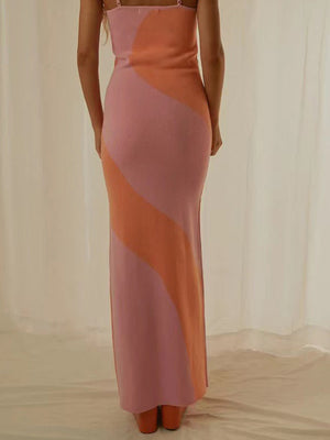 Geometric knit maxi slip dress in pink and orange with diagonal color blocking.