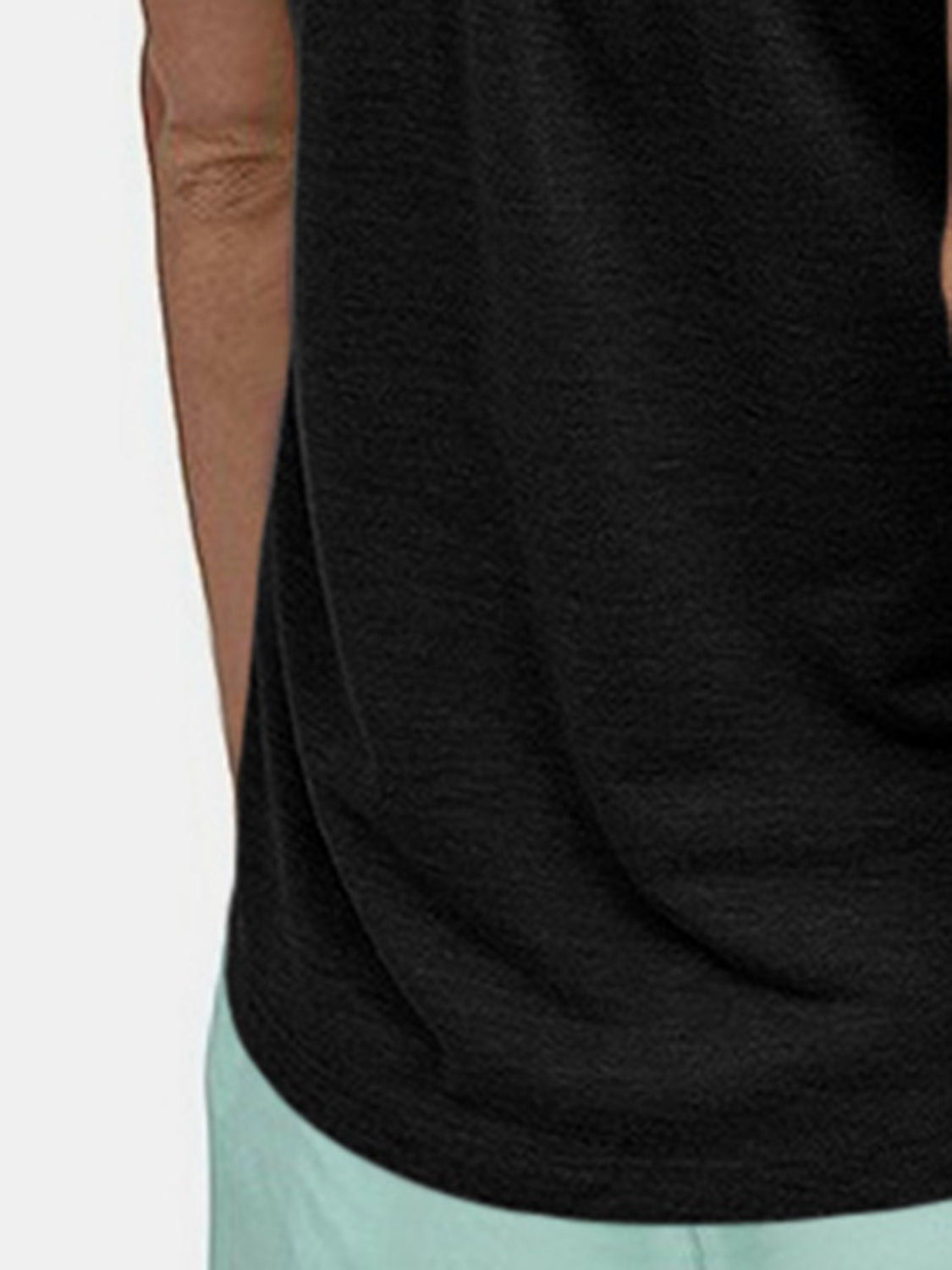 Black racerback tank top with textured fabric and a relaxed fit.