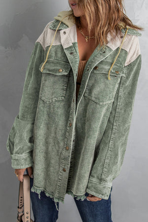 Colorblock corduroy hooded utility jacket in Sage with contrast cream yoke and frayed hem.
