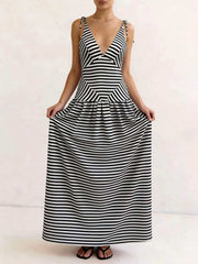 Maxi dress with V-neck, tie straps, and black and white chevron stripes.