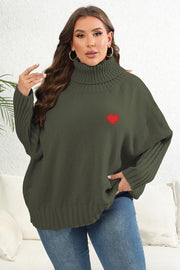 Army green knit turtleneck sweater with red heart appliqué and batwing sleeves.