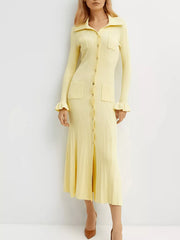 Yellow knit midi dress with polo collar, button front, and ruffled cuffs.