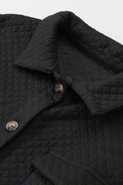 Black quilted overshirt with button details and patch pocket flap.