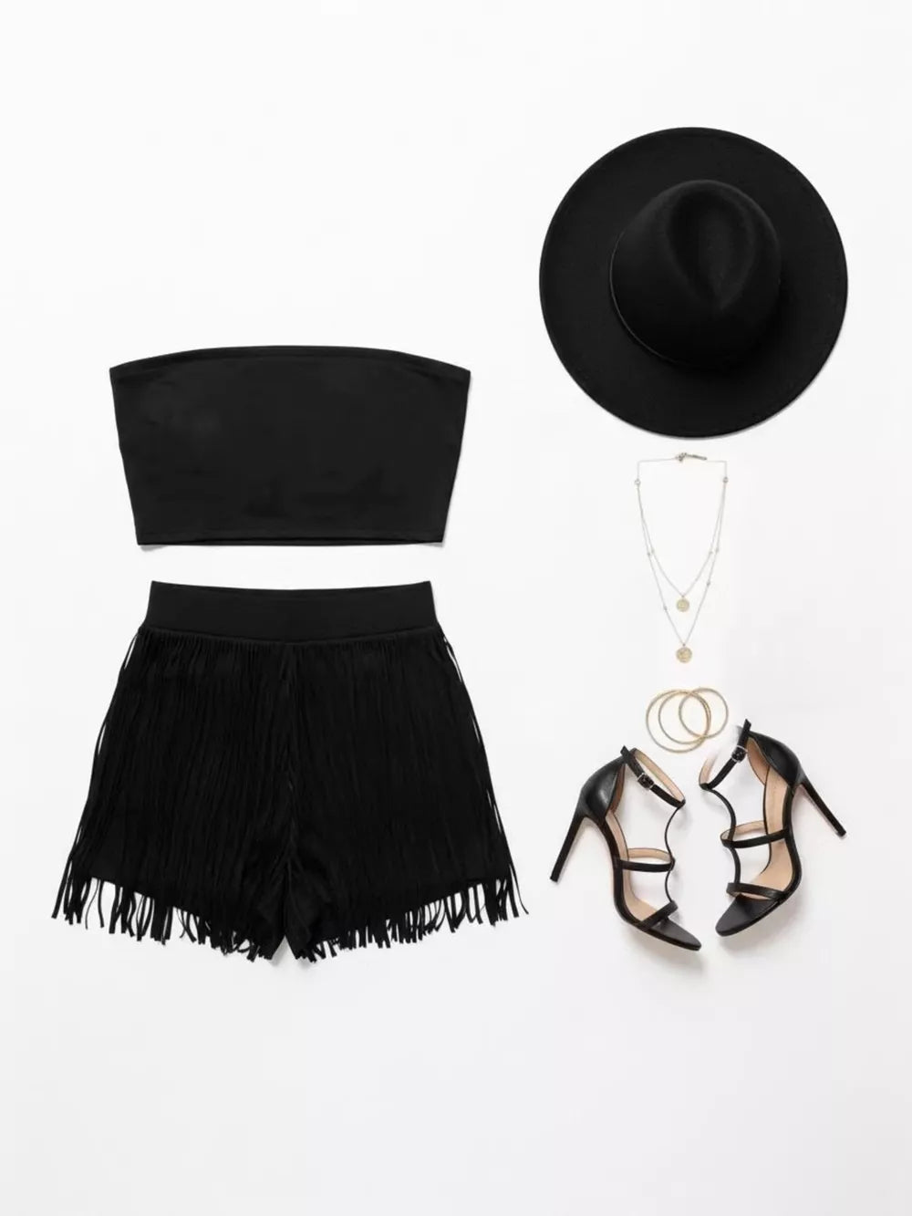 Black fringe shorts and bandeau top two-piece set with strappy heels and hat.