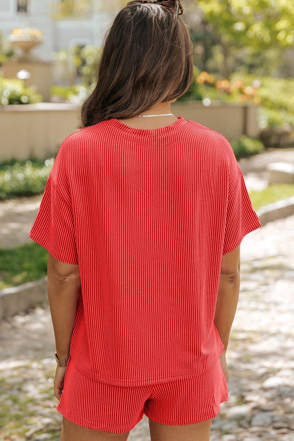Orange-red ribbed co-ord set with boxy tee and shorts.