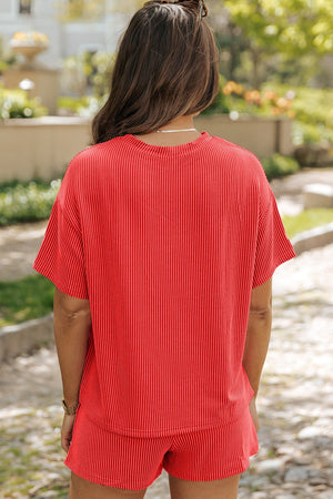 Orange-red ribbed co-ord set with boxy tee and shorts.