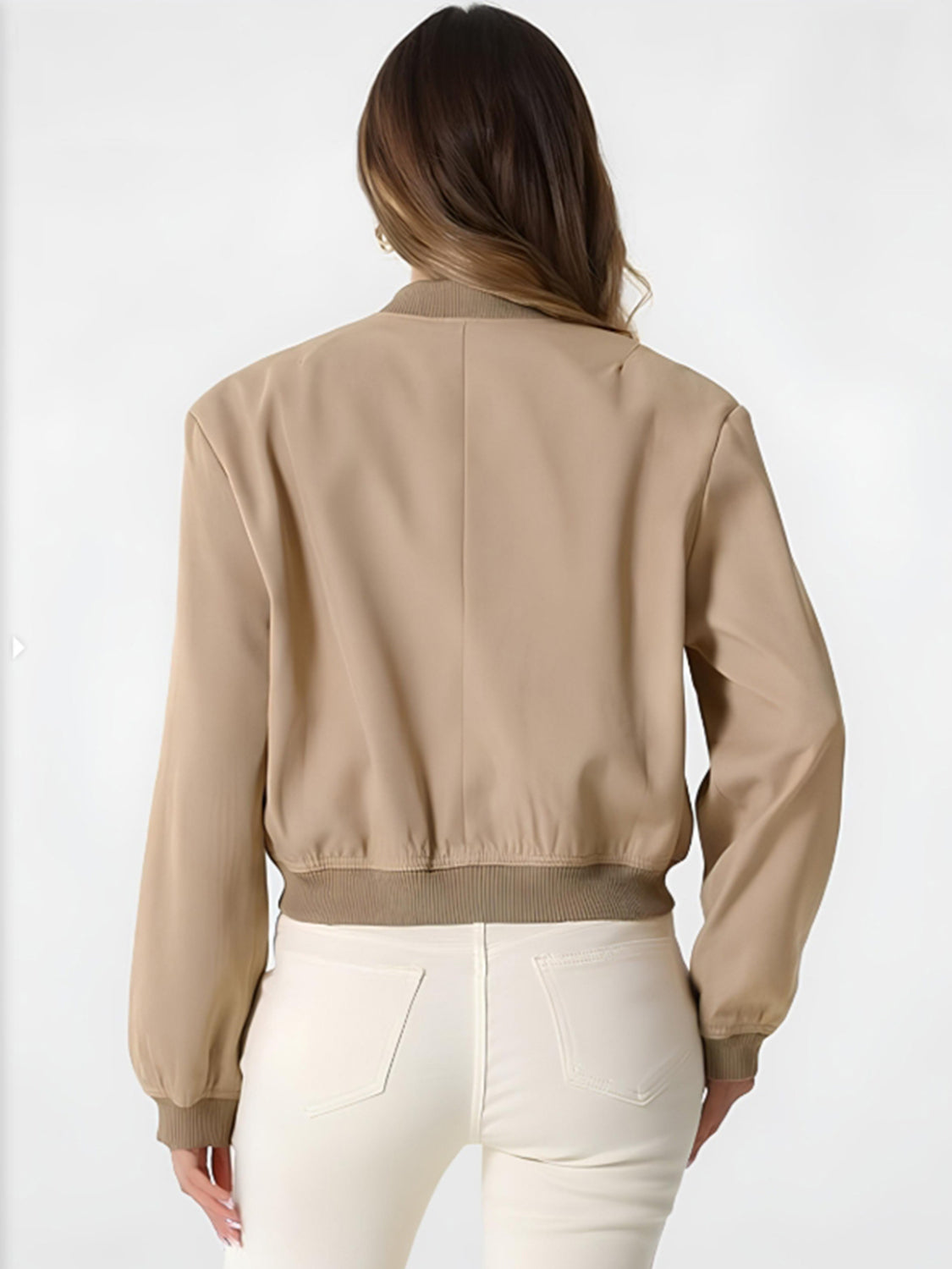Tan bomber jacket with ribbed cuffs and hem, shown from the back.
