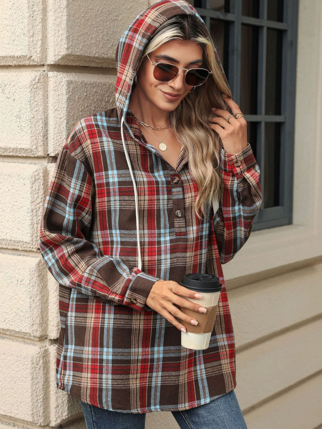 Plaid henley hooded shirt in brown with red and blue plaid, featuring a buttoned placket and drawstring hood.