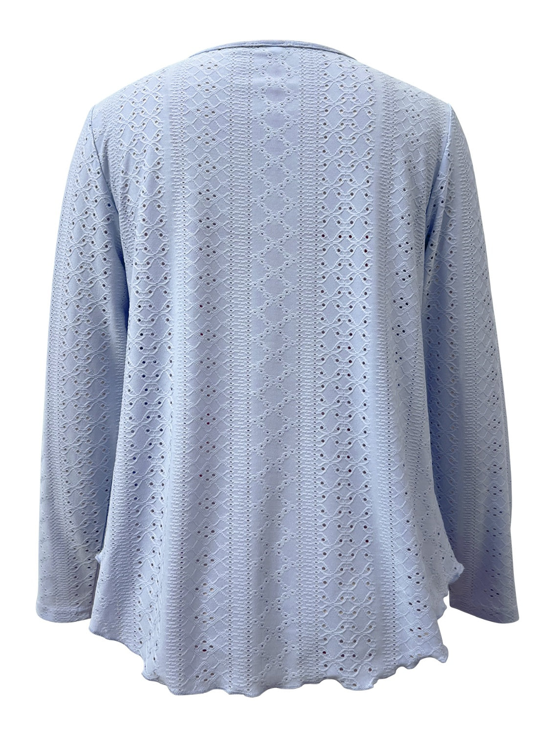 Light blue eyelet blouse with scalloped hem and long sleeves.