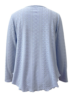 Light blue eyelet blouse with scalloped hem and long sleeves.
