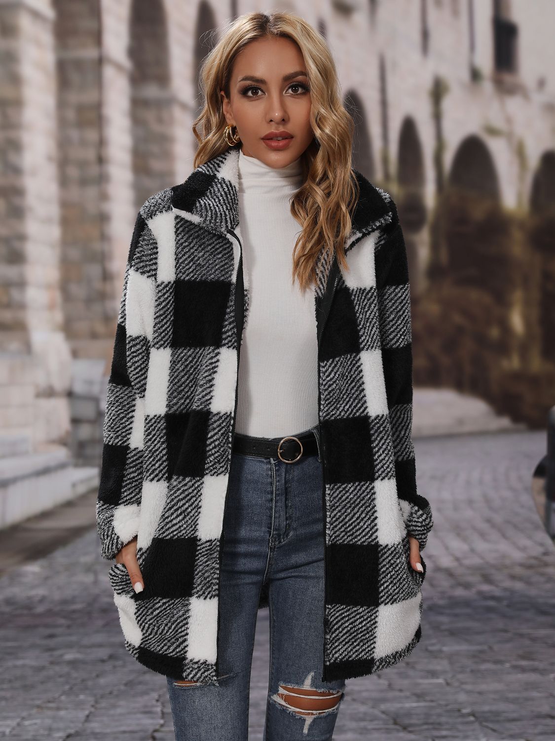 Checked plaid teddy coat with oversized collar in black and white, featuring a fuzzy texture and open front.