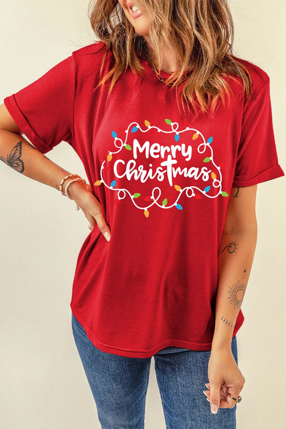 Red round neck tee with Merry Christmas lights graphic and rolled sleeves.