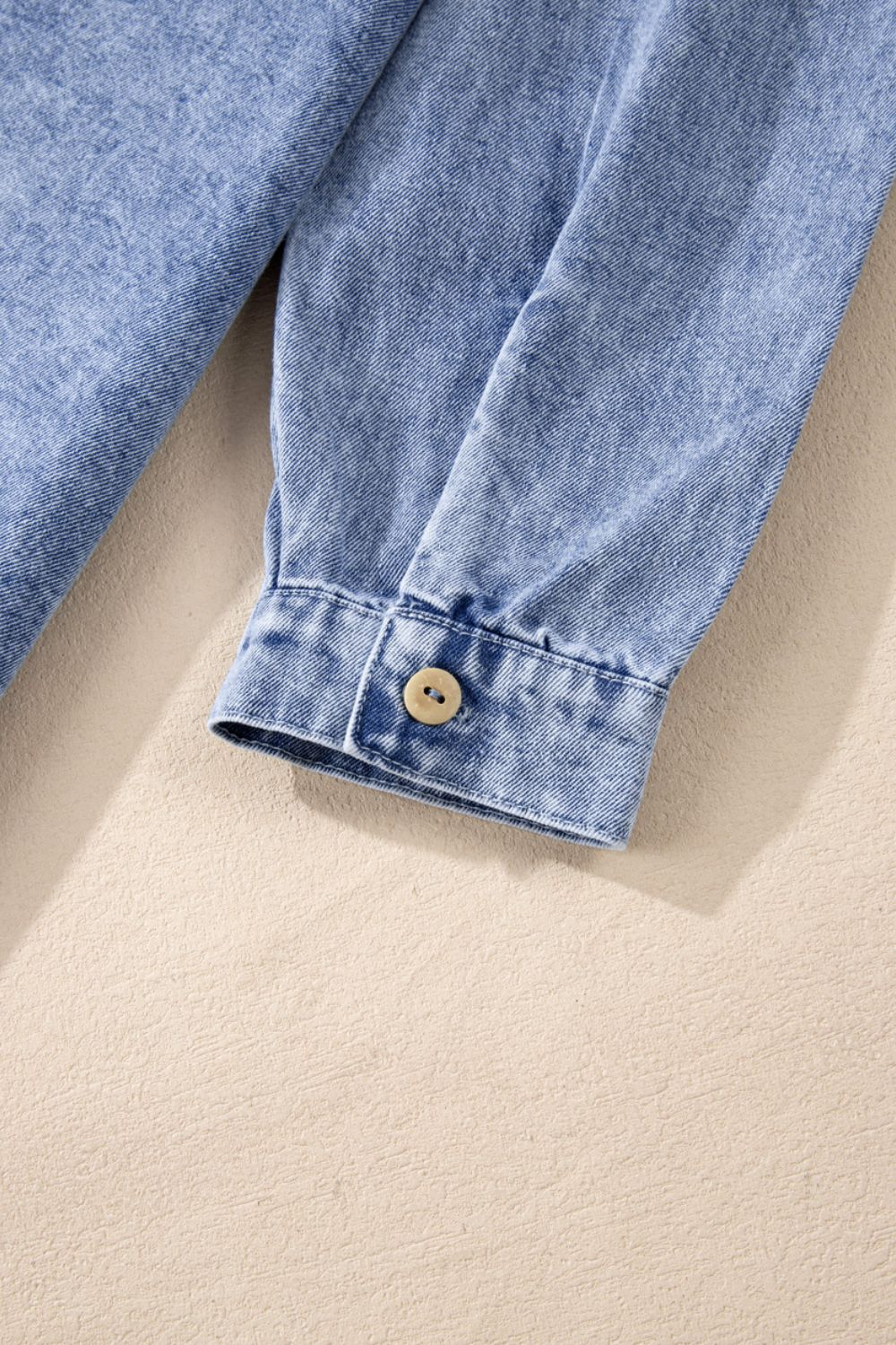 Acid wash denim shirtdress in medium with button cuff detail.