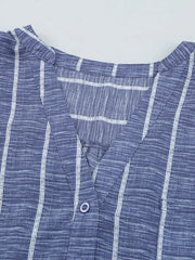 Dusty blue striped V-neck buttoned blouse with a textured fabric.