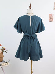 Haze Blue cotton romper with flutter sleeves, tie waist, and back keyhole detail.
