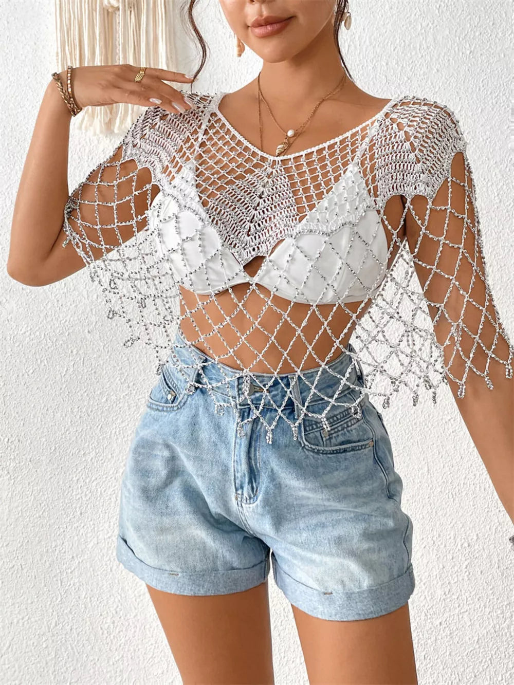 Luxe beaded crochet cardigan in gold, white, or black with cutout detail.