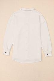 Textured ivory overshirt with a collared neckline and button cuffs.
