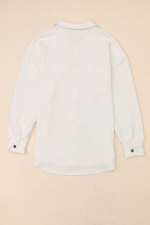 Textured ivory overshirt with a collared neckline and button cuffs.
