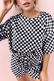 Black and white checkered loungewear set with drawstring shorts and a short-sleeve top.