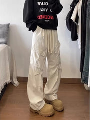 Relaxed fit apricot cargo pants with drawstring and multi pockets.