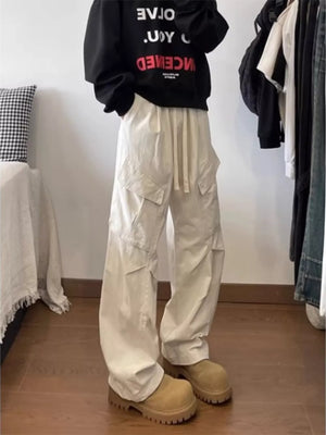 Relaxed fit apricot cargo pants with drawstring and multi pockets.