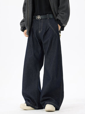 Dark wash denim jeans with exaggerated wide legs and contrast stitching.