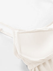 Ivory soft-cup cami with adjustable straps and a seamless neckline.