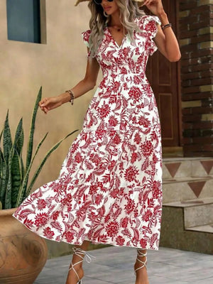 Botanical ruffle sleeve midi dress in white with red floral print, V-neck, smocked waist, tiered skirt.