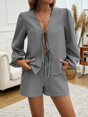 Black gingham tie-front blouse with puff sleeves and matching shorts set