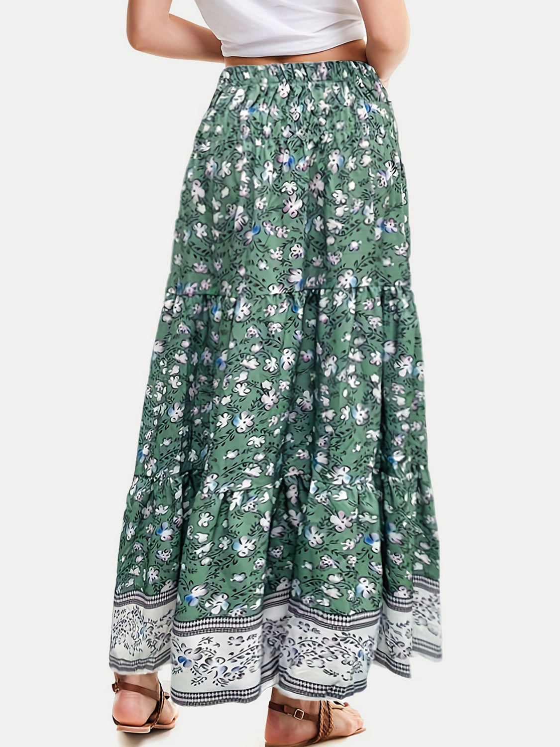 Green floral maxi tiered skirt with border print hem and smocked waist.