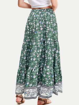 Green floral maxi tiered skirt with border print hem and smocked waist.
