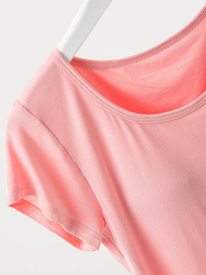 Built-in bralette tee in soft pink with a scoop neckline and short sleeves.