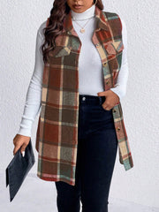 Oversized plaid shirt vest in brown, camel, and red with buttoned front and chest pockets.